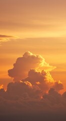 Fototapeta premium Fiery sunset canvas: majestic clouds bathed in vibrant golden hues