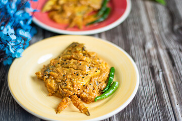 Spicy pabda fish curry gravy.