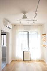 bright minimalist room interior with sunlight streaming through sheer curtains