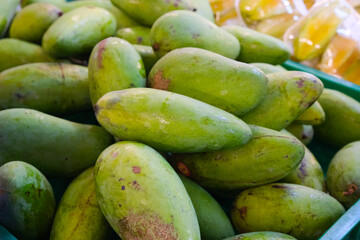 Unripe Green Mangoes in Market Crate, Close Up