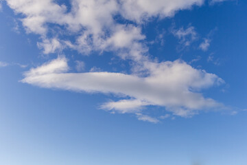 Serene Cloudscape Over Clear Blue Sky in Western BC, Canada