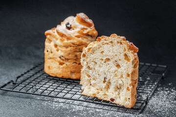 Freshly baked sweet bread with a decorative twist on a cooling rack