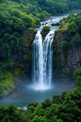 a view of a waterfall in the middle of a lush green forest