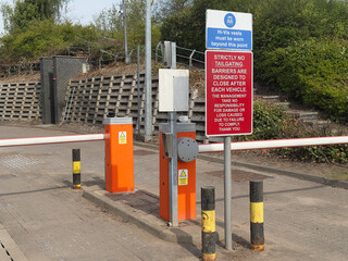 Access control barriers at private car park outside office building