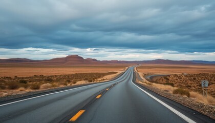 Naklejka premium Winding Highway Through Desert Landscape