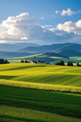 Fototapeta premium arafed view of a farm in a green field with mountains in the background