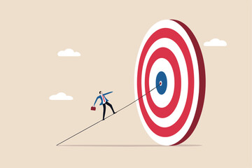 Set goal and take action to achieve goal or target, aiming or motivation to grow business and success, effort or skill to reach goal concept, businessman walking on the line aiming at target bullseye.