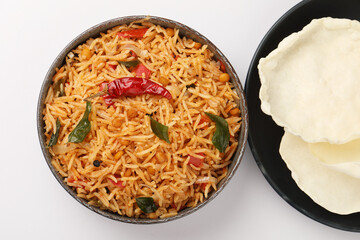 South Indian food Tomato Rice served in a ceramic bowl 