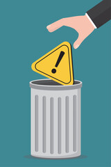Businessman hand throw giant warning sign into metal garbage container. Incident management, root cause analysis or solving problem, identify risk or critical failure concept