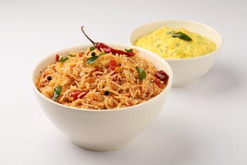 South Indian food Tomato Rice served in a ceramic bowl 