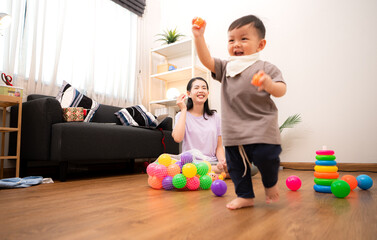 Fototapeta premium While in vacation at home, a mother engages in activities with little kid