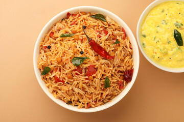 South Indian food Tomato Rice served in a ceramic bowl 