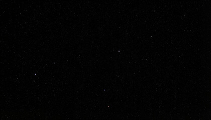 Obraz premium Night sky filled with stars against a dark background 