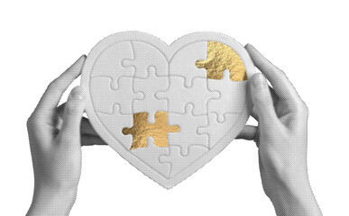 Golden heart puzzle piece held gently by hands, symbolizing love, healing, and emotional support....