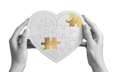 Golden heart puzzle piece held gently by hands, symbolizing love, healing, and emotional support. The shiny, warm foil texture represents recovery and connection, mending a broken bond and bringing.