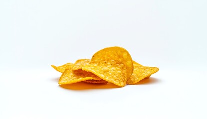 Fototapeta premium Crispy Golden Snack Chips Piled on White Background for Delicious Treat