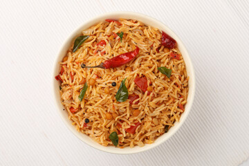 South Indian food Tomato Rice served in a ceramic bowl 