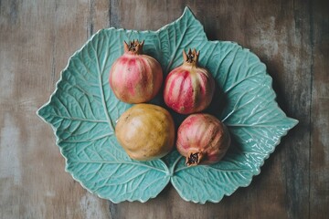 Four Pomegranates on Teal Leaf Plate Still Life Photography