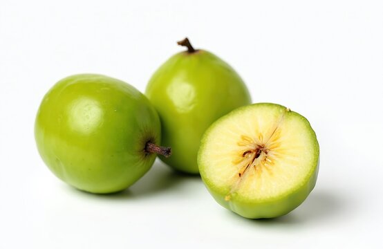 Fresh, ripe umbu fruits Spondias tuberosa isolated white background. Green fruit with a cut half showing juicy pulp. Healthy snack or ingredient for culinary, diet, vegan.