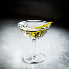 Martini with a lemon twist in a crystal glass