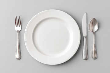 Black Cap Placed on a White Ceramic Plate Beside Polished Silver Cutlery Set During a Formal Dining Preparation