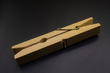 Wooden Clothespin on Dark Background – Vintage Laundry Clip Close-Up
