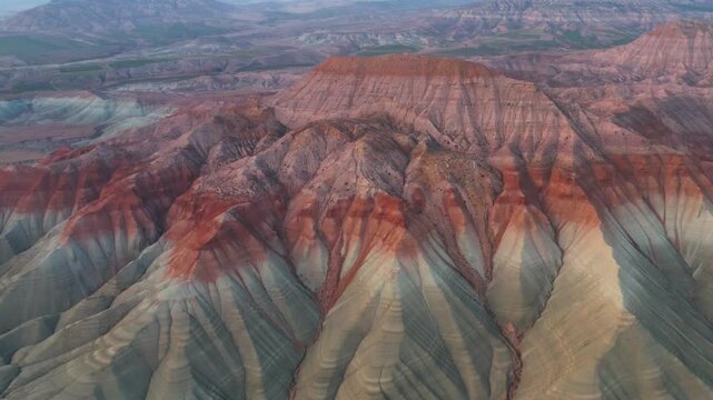In Nallıhan Bird Paradise National Park, as the drone moves away, geological structures and colorful soil formations can be seen. This natural monument, shaped by erosion, offers a fascinating view.
