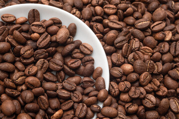 Textured Background of Freshly Roasted Coffee Beans Close-up. Food Photos for Backgrounds or Recipes
