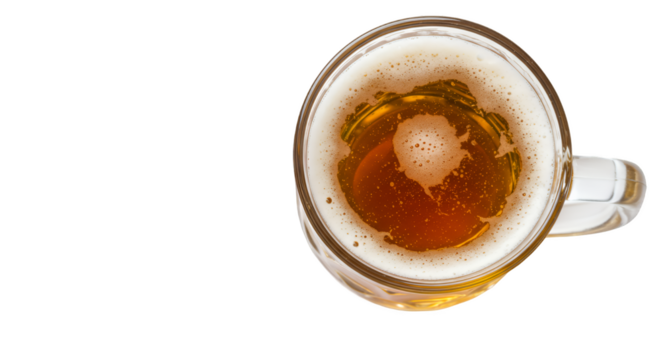 Overhead shot of refreshing beer in glass mug with frothy foam