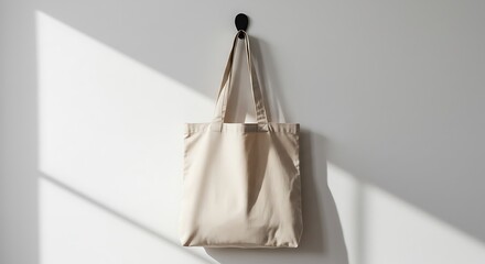 Beige Tote Bag Hanging on White Wall