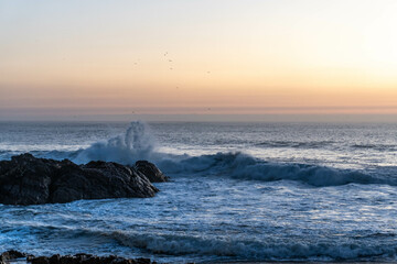 Waves crashing against the rocks on the shore of the Atlantic Ocean