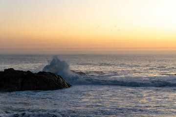 Waves crashing against the rocks on the shore of the Atlantic Ocean