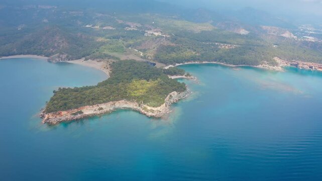 Wide and impressive view of the magnificent Phaselis Bay and ancient city in the Kemer region of Antalya, T&uuml;rkiye, taken with a drone.
