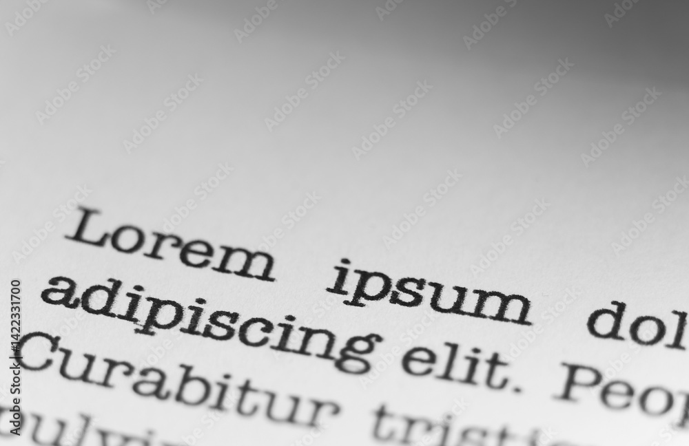 Fototapete lorem ipsum text printed on a page. a piece of paper with words written in retro typewriter font.
