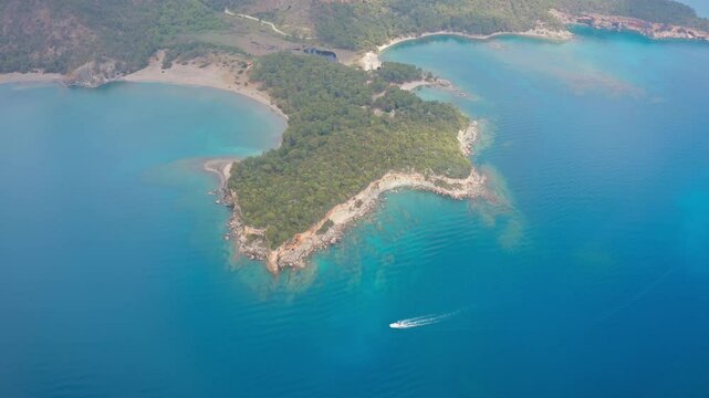 Wide and impressive view of the magnificent Phaselis Bay and ancient city in the Kemer region of Antalya, T&uuml;rkiye, taken with a drone.