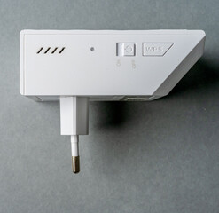 Side view of plug in wifi range extender.