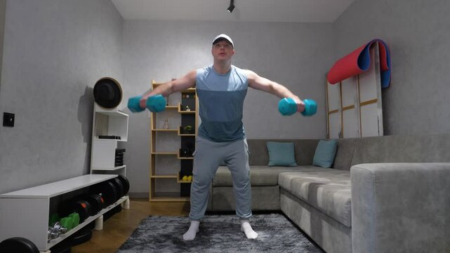  Dumbbell lateral raises with hands, pumping up the muscles of the shoulder delta, workout with dumbbells at home, slow motion. Training on a bench press.