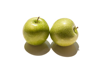 Two ripe juicy beautiful green apples isolated with shade