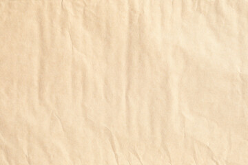 Brown crumpled paper with bumpy vertical lines