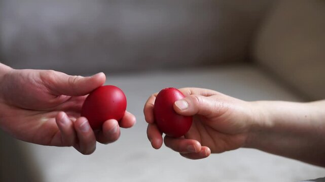 Close up of hands egg tapping