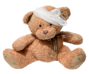Soft brown teddy bear with stitched patches, head bandage, and plaid bow tie, isolated on white background. Symbol of care, childhood, and healing.