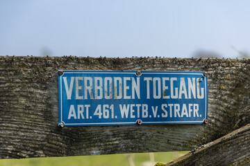 "Verboden toegang" sign on a wooden weathered fence: No Trespassing sign. Utrecht, Netherlands, 11 April 2025.