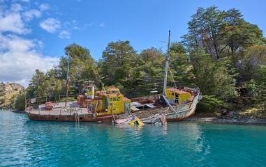 Abandoned ship in General Carrera Lake in Chile - remains of the closed mining industry. A ship located in a way of the boat tour to Marble Caves, attraction in the region.