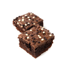 Chocolate brownie cake sprinkled with white and dark balls, classic birthday brownie square piece