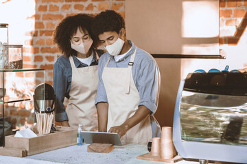 Online takeaway coffee orders and new normal for small businesses. Millennial african american lady...