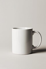 minimalist white ceramic mug against neutral background perfect for branding projects or coffee enthusiasts seeking simple elegance. ideal for showcasing custom designs or relaxation themes