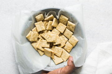 Overhead view of homemade crackers, top view of freshly baked cracker biscuits, process of making crackers