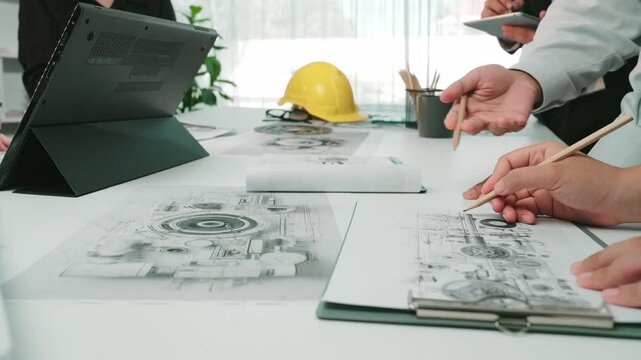 A vibrant office scene where diverse professionals engage in a brainstorming session, analyzing blueprints and sharing innovative ideas to drive project success. SACTR
