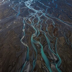 Aerial panorama view of braided river arms streams delta, glacial pristine clear azure blue Southern Alps mountain water at Lake Pukaki, New Zealand