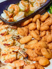 Popcorn, Grilled, And Scampi Shrimp On A Plate